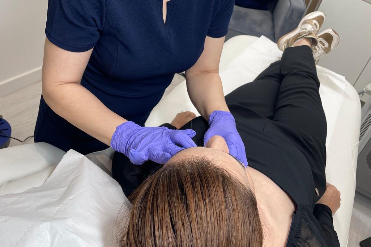 Anti-wrinkle injections being administered to the forehead by a trained practitioner